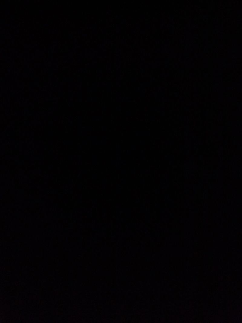 A photograph of a tall, dark, and handsome man.
